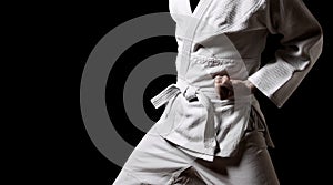 Karateka isolated on black photo