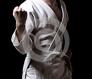Karateka isolated on black photo