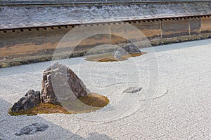 The Kare-sansui dry landscape zen garden at Ryoan-ji Temple in Kyoto, Japan. It is part of Historic