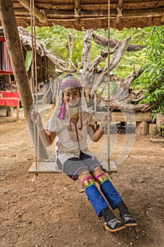Karen woman from Pai at Mae Hong Son, Thailand playing swing