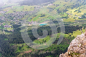Karersee village from Latemarspitze mountain peak in Latemar mountain group in Dolomites photo