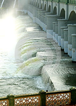 Speedy water from the Grand aged dam of Kallanai constructed by king karikala chola with granite stone. photo