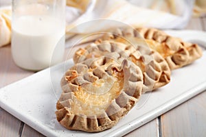 Karjalanpiirakat, Karelian pasties on a rustic table