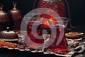Karkade tea - red tea in Turkish cups on dark background