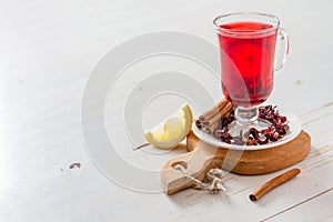 Karkade tea on white wood background