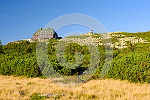 Karkonosze Mountains, Szrenica shelter in the Western Sudetes, mountain landscape with alpine vegetation on a sunny summer day