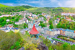 Karlovy Vary Carlsbad historical city centre top aerial view with colorful beautiful buildings, Slavkov Forest