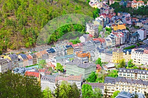 Karlovy Vary Carlsbad historical city centre top aerial view with colorful beautiful buildings, Slavkov Forest