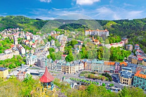 Karlovy Vary Carlsbad historical city centre top aerial view with colorful beautiful buildings, Slavkov Forest hills