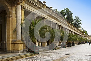 KARLOVY VARY, CZECH REPUBLIC - SEPTEMBER 14, 2014:Tourist walk along of the Mill Colonnade, one of the most historically famous ho