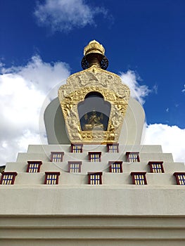 Karma Thegsum Tashi Gomang Stupa with enshrined Buddha photo