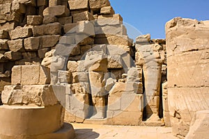 Karnak temple complex in Luxor, Egypt. Ruins of ancient temple with broken statues of pharaohs