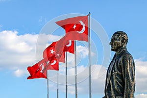 Karsiyaka / Bostanli / Izmir / Turkey, Mustafa Kemal Ataturk sculpture and Turkish flag