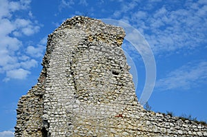 Karst areas where all the walls are built of limestone. a castle from the Middle Ages destroyed with a collapsed orvor in the wall