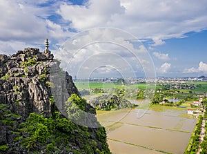 Karst formations and rice paddy fields from the lying dragon mountain, Tam Coc, Ninh Binh province, Vietnam