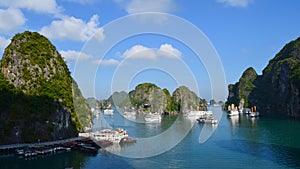 Karst landforms in the sea y Tourist junks in Halong bay in Vietnam, South Asia. The world natural heritage. Travel destination