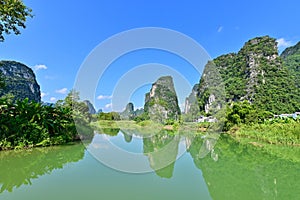 Karst Landscape with Reflection on Water of Mingshi Pastoral Scenic Area