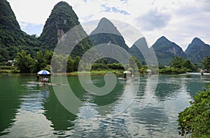 Karst mountains reflected in Yulong river