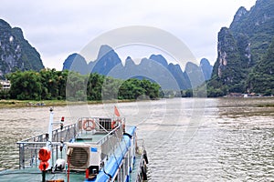 Karst peaks in Xingping Town and pleasure boat on the Li River