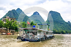Karst peaks in Xingping Town and pleasure boat on the Li River