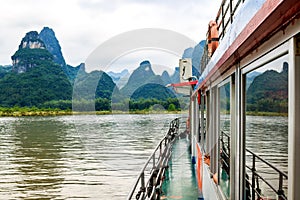 Karst peaks in Xingping Town and pleasure boat on the Li River