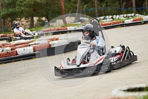 Karting. motorsport road racing with open-wheel four wheeled vehicles at go-karts