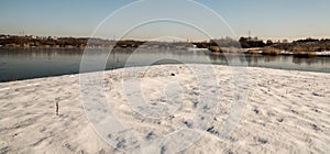 Karvinske more lake near Karvina city in Czech republic during winter day with snow and clear sky