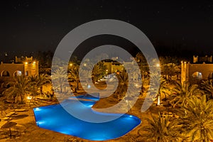 Kasbah-Hotel Chergui. Pool and garden of a maroccan kasbah hotel at night, Maroc, Africa