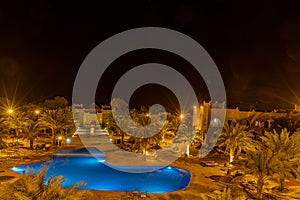 Kasbah-Hotel Chergui. Pool and garden of a maroccan kasbah hotel at night, Maroc, Africa