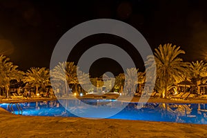 Kasbah-Hotel Chergui. Pool and garden of a maroccan kasbah hotel at night, Maroc, Africa