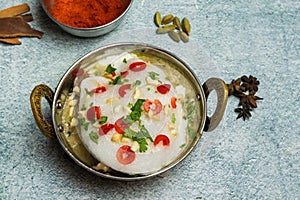 Kashmiri Chicken karahi with onion and chili served in a dish isolated on grey background top view of bangladesh food