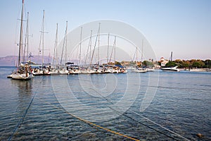 KASTOS island, GREECE-August,2019: Port of Kastos island with moored sailboats - Ionian sea, Greece in summer.