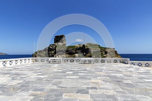 The Kastro fortress opposite Rivas Square in the city of Chora Andros Island, Greece, Cyclades photo