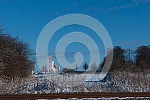 Kastrup Church in Denmark in winter landscape