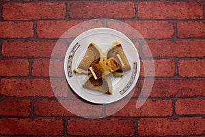 Katari Bhog sweet served in plate isolated on background top view of bangladeshi dessert food