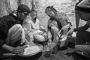 KATHMANDU, NEPAL - children during dinner at Jagadguru School.