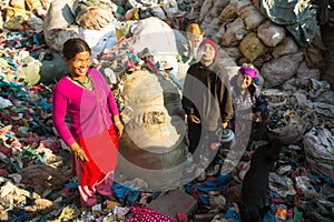 KATHMANDU, NEPAL - people from poorer areas working in sorting of plastic on the dump