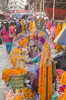 Street vendors of bright colorful fresh flowers for Diwali. street market on pedestrian street