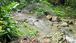 Kathu waterfall water gently flowing down the rocks Patong Phuket Thailand