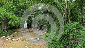 Kathu waterfall water gently flowing down the rocks Patong Phuket Thailand