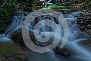 Kathu waterfall water gently flowing down the rocks Patong Phuket Thailand Asia