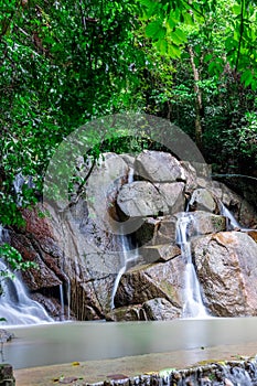 Kathu waterfall water gently flowing down the rocks Patong Phuket Thailand Asia