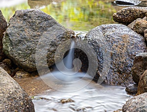 Kathu waterfall water gently flowing down the rocks Patong Phuket Thailand Asia