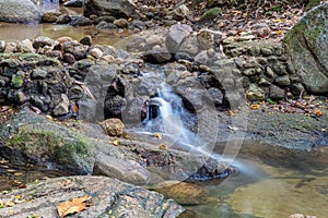 Kathu waterfall water gently flowing down the rocks Patong Phuket Thailand Asia