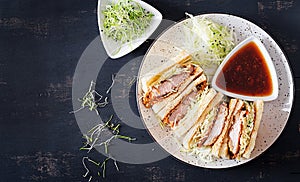 Katsu Sando - food trend japanese sandwich with breaded pork chop, cabbage