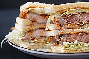 Katsu Sando - food trend japanese sandwich with breaded pork chop, cabbage photo
