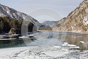 Katun river covered with ice in autumn, village Barangol, Altai Republic, Russia