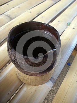 Kawa Daun Served in a Coconut Shell Cup photo