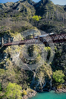 Kawarau Bridge, New Zealand, October 6, 2019: Modern European boy bungee jumping at A.J. Hackett