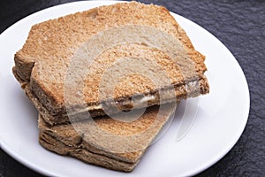 Kaya Toast (Asia Snack) on the white dish and table.